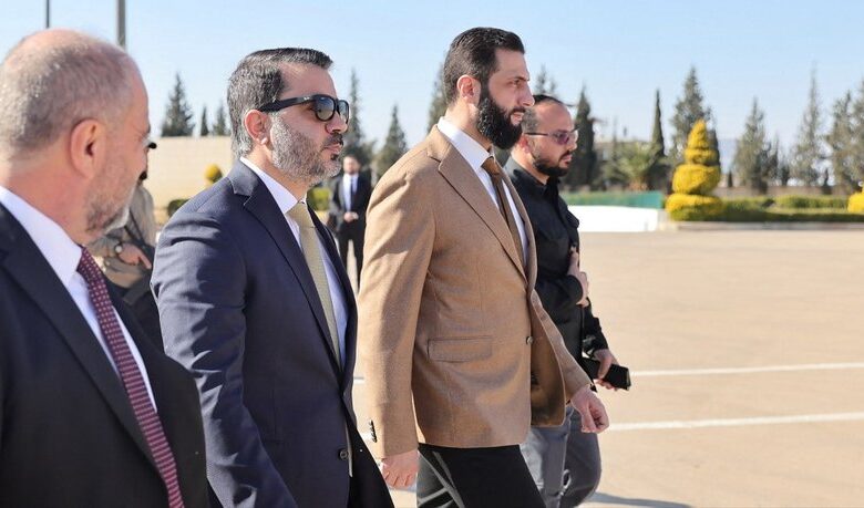 A handout picture released by the official Syrian Arab News Agency (SANA) on February 4, 2025, shows Syria's president Ahmed al-Sharaa (R) and interim Foreign Minister Asaad al-Shaibani walking on the tarmac at the Jeddah Airport ahead of boarding a flight to Turkey. (Photo by SANA / AFP) / == RESTRICTED TO EDITORIAL USE - MANDATORY CREDIT "AFP PHOTO / HO / SANA" - NO MARKETING NO ADVERTISING CAMPAIGNS - DISTRIBUTED AS A SERVICE TO CLIENTS == / The erroneous mention[s] appearing in the metadata of this photo by - has been modified in AFP systems in the following manner: [Jeddah airport] instead of [Damascus]. Please immediately remove the erroneous mention[s] from all your online services and delete it (them) from your servers. If you have been authorized by AFP to distribute it (them) to third parties, please ensure that the same actions are carried out by them. Failure to promptly comply with these instructions will entail liability on your part for any continued or post notification usage. Therefore we thank you very much for all your attention and prompt action. We are sorry for the inconvenience this notification may cause and remain at your disposal for any further information you may require.
